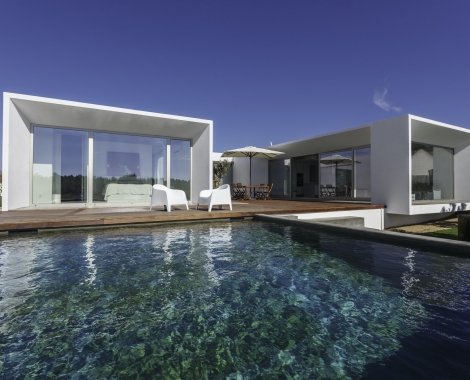 Modern house with garden swimming pool and wooden deck